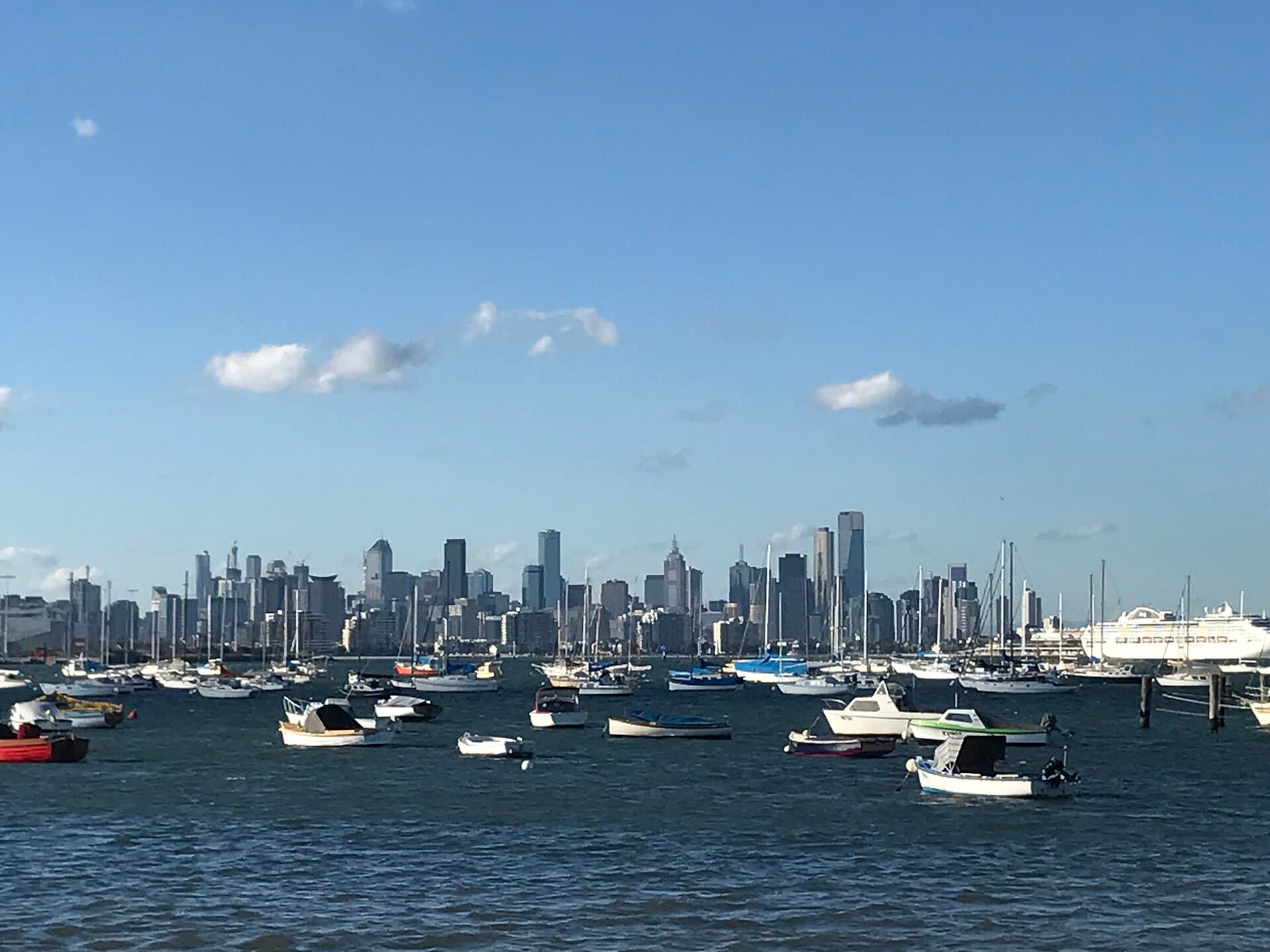 Melbourne city skyline across the bay from Williamstown, with yachts in the foreground